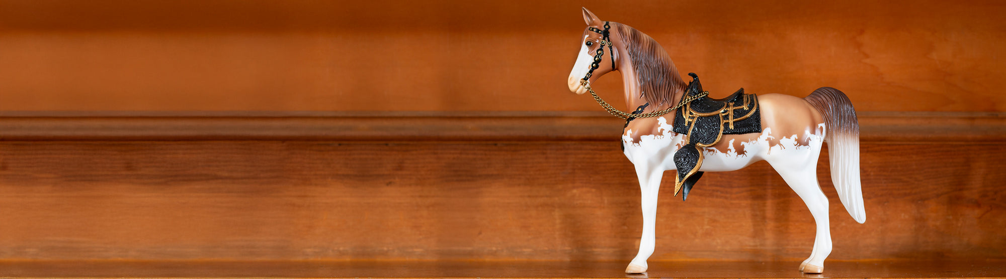 The Western Horse | Breyer 75th Anniversary Traditional model standing on a staircase.