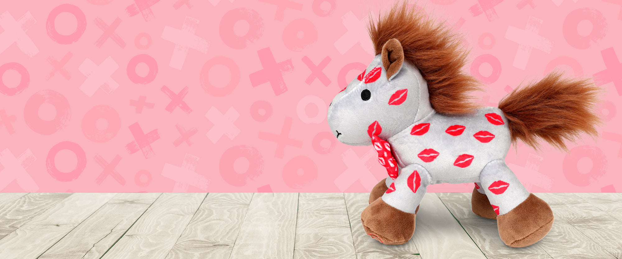 Smooch | 2025 Valentine's Day Plush on a pink background facing left