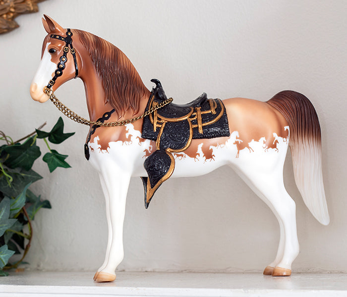 The Western Horse | Breyer 75th Anniversary Traditional model standing on a shelf next to a plant