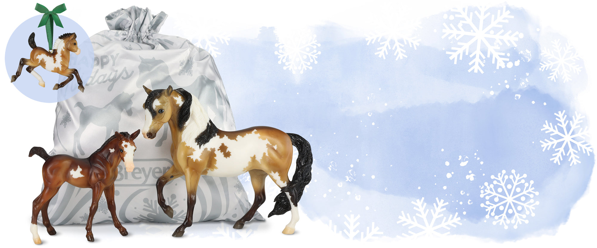 Freya & Annika models shown with ornament on a snowy background - desktop banner