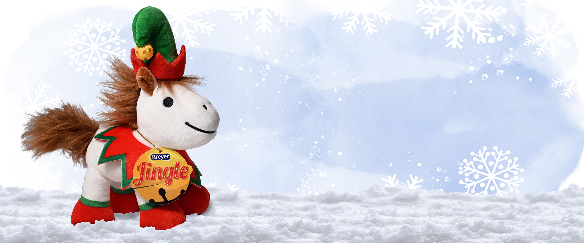 Jingle - The 2024 Holiday Plush on a snowy background