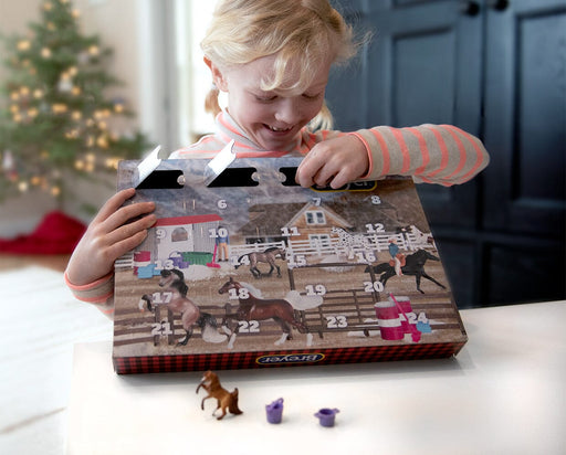 A girl opening the Breyer Advent Calendar | Horse Adventure 