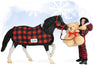 Holiday Pajama Party with Cinders, a tobiano pinto pony wearing buffalo plaid blanket, Christy in buffalo plaid pjs, and teddy bear