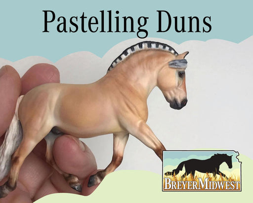 Pastelling Duns | BreyerMidwest 2025 - a hand holding a stablemates model