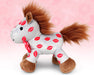 Smooch | 2025 Valentine's Day Plush one an pink background facing left