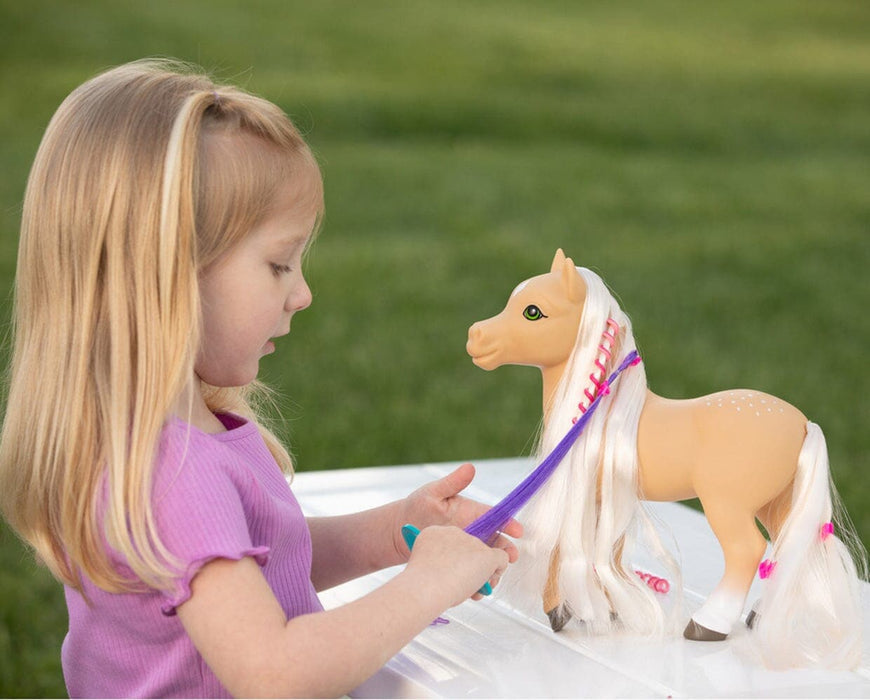 A girl combing the mane of Sunflower | Mane Beauty Styling Pony