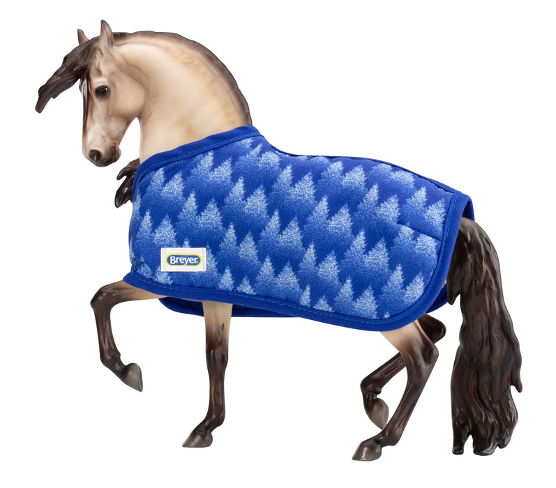 Traditional Holiday Horse Blanket; buckskin horse wearing blanket with blue trees with blue trim