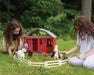 Two girls playing with the two stall barn, models and figures