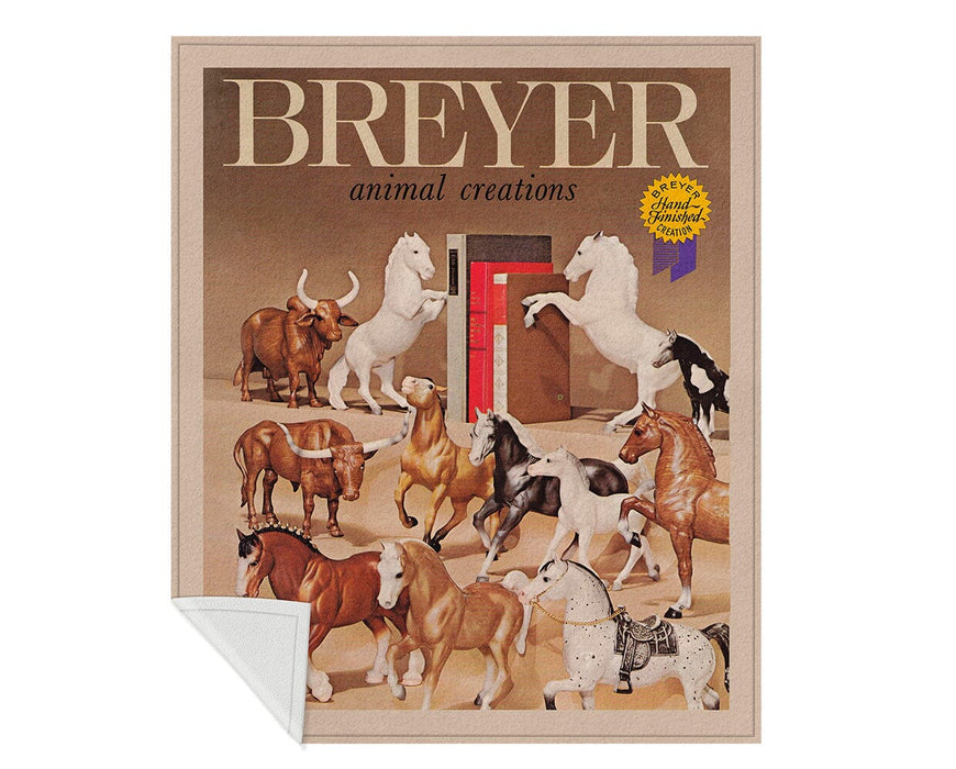 Vintage Throw Blanket featuring older Breyer horses and animals, shown with the corner folded over