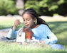 a girl painting the Horse & Barn Paint & Play outside