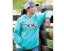 a girl wearing the Unisex Southwest Hoodie and Breyer cap